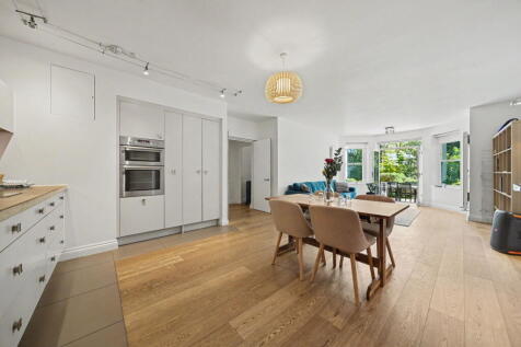 Quote GS1270 - A large two bedroom lateral apartment with a superb patio forming part of an impressive Victorian white stucco-fronted building situated in the heart of Belsize Park. Ground floor. Comm