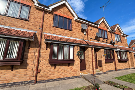Sunlit Brick Terraced Homes.png
