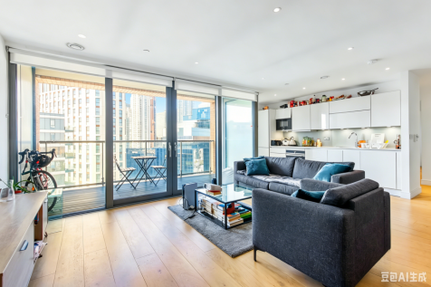 This spacious three bedroom 15th floor apartment is situated in The Liberty Building in Canary Wharf. The apartment boasts a good sized living room with wooden flooring and a dining area which is open