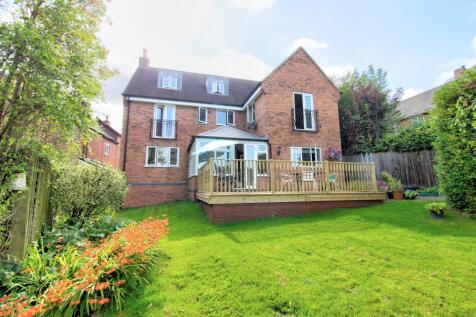 Rear view of property and decked area