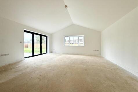 lounge with vaulted ceiling