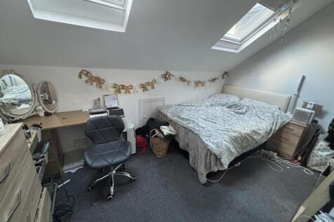 Bright attic double bedroom with two skylight w...