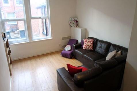 A cozy, well-maintained living room featuring a...