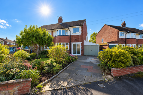 Sunlit Red-Brick Suburban Home.png
