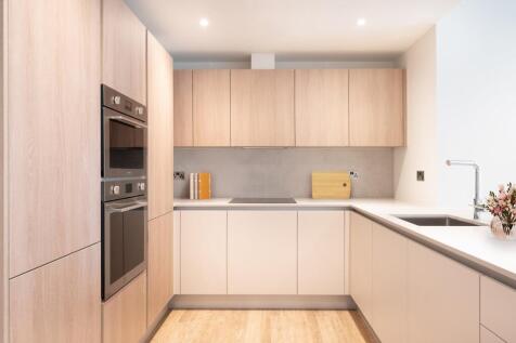 Explore this sleek modern kitchen, where style meets functionality.