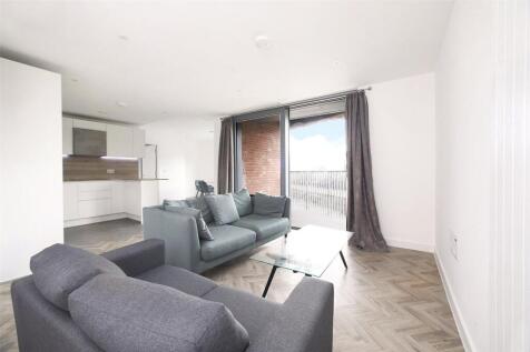 An impressive 1,162 sq ft, three bedroom, three bathroom dual aspect modern apartment with two balconies and water views located within Skyline Apartments, a stylish landmark development with concierg