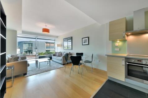A spacious two bedroom apartment with parking set in a sought after canalside development nearby City Road Basin, Islington. The open plan living comprises a kitchen/ living room, master bedroom with