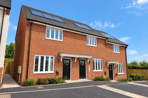 A red brick semi-detached house with solar panels on its roof stands before a paved driveway under a