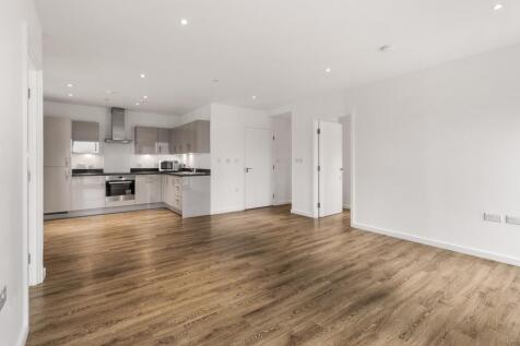 Experience open-concept living with this stylish kitchen and expansive living area.