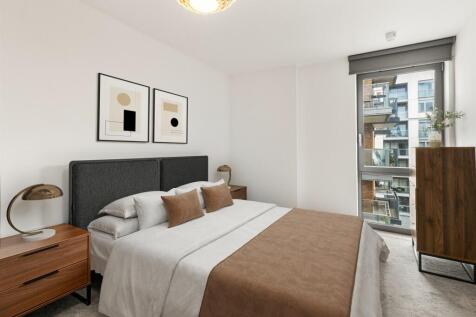 Explore this elegantly designed bedroom, a perfect retreat for relaxation with its modern furnishings and ample natural light.