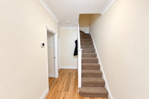Bright Minimalist Hallway with Staircase.png
