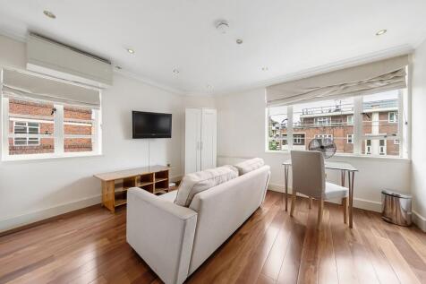LONG LET. Set within a striking period building, this fantastic 1 bedroom apartment boasts stylish interiors and includes an open-plan kitchen, neutral decor and a sleek bathroom suite.