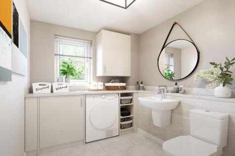 A downstairs toilet and utility room adds convenience
