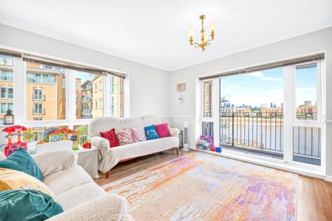 A beautifully presented dual aspect, direct river facing, two bedroom, two bathroom apartment with private balcony providing wonderful river views, lift access and access to communal courtyards/garden