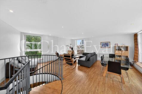 A stylish two bedroom, two bathroom duplex apartment set within this unique development. The apartment includes an expansive living space split across two floors. The first floor includes a separate f