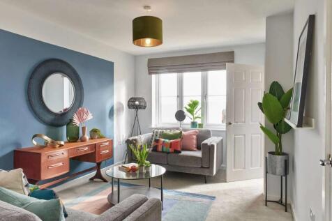 A cozy and vibrant living room with a mix of modern and vintage elements