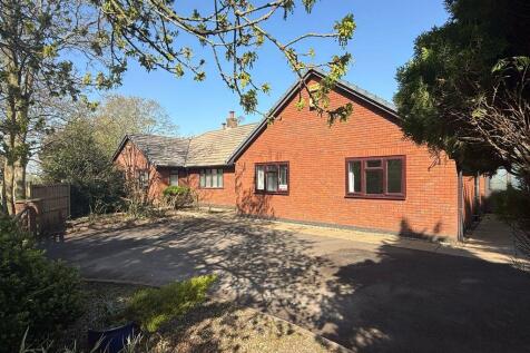 The property comprises a five-bedroom detached bungalow, two timber stable blocks and tack room, and land, in all extending to 2.8 hectares (7 acres) or thereabouts as shown edged red on the plan in t