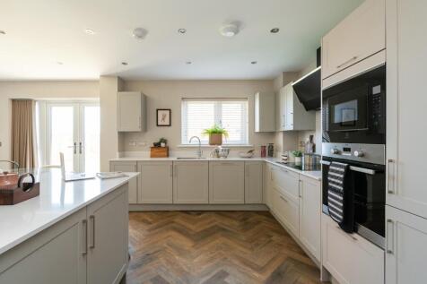 The kitchen provides ample storage space
