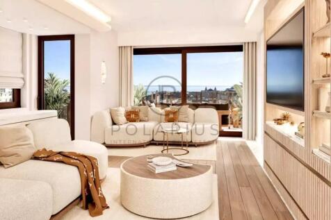 This is a bright, modern living room with large wi