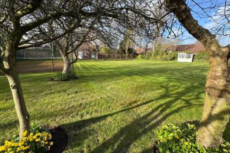 Back garden and tennis court
