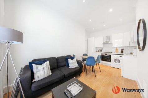 A modern two double bedroom flat available to rent in a converted period building on Queensway, W2. The apartment benefits from wooden floors throughout; a modern open plan kitchen with reception room
