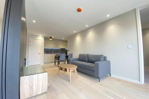 A modern 2-bedroom, 2-bathroom apartment in the vibrant Spinners Way development, featuring an open-plan living area, sleek kitchen, and private balcony. Residents enjoy access to a gym, residents' lo
