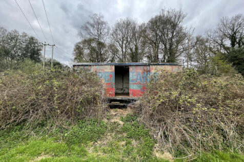 Land and trailer for sale with exciting potential.