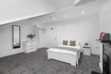 Bright, recently redecorated bedroom with neutr...