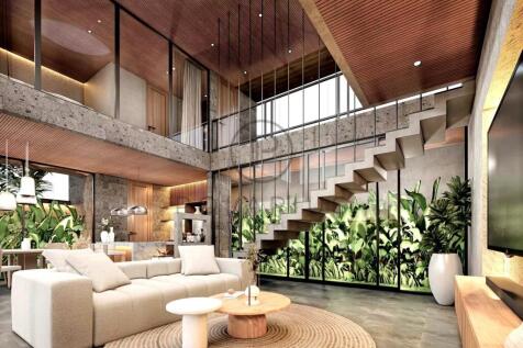 Modern living room with a high ceiling, featuring