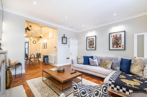SHORT LET: A beautifully presented fully furnished two bedroom apartment with patio garden convenient for Victoria Station 0.3m and Belgravia 0.2m.