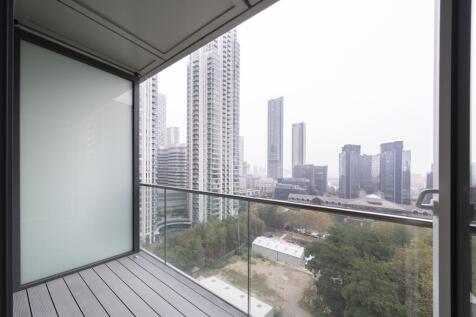 Experience urban luxury with this stunning high-rise balcony view.