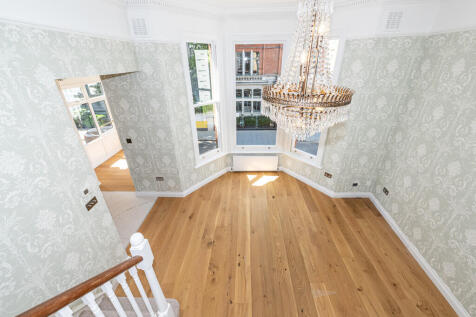 An exceptionally bright and spacious (749 sq.ft.) ultra-modern 2-bedroom split level flat on the first floor of a red brick period end of terrace house conversion. This luxurious well-proportioned pro