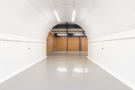 An empty arch with white lining, made up of two interlinked arches.