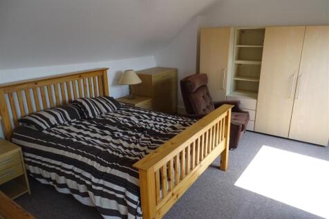 Bright, neatly presented bedroom with a double ...