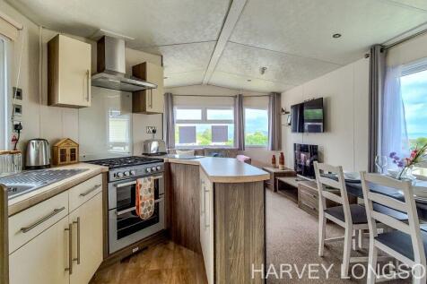 Open plan kitchen dining and living area in the De
