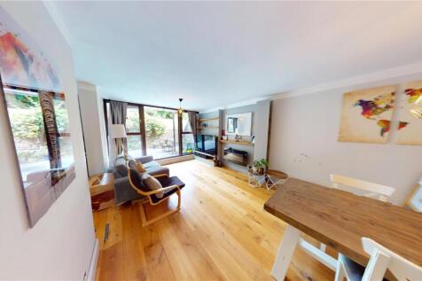 BEAUTIFUL TWO BEDROOM FLAT WITH PARKING AND COMMUNAL SWIMMING POOL. This lovely ground floor flat comprises a spacious living/dining area leading onto a large patio garden. There is also a separate di