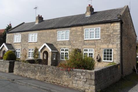 A spacious three bedroom cottage within Tadcaster Grammar School catchment area. Fully updated throughout and with accommodation as follows: Dining Kitchen, Utility with separate downstairs wc, two re