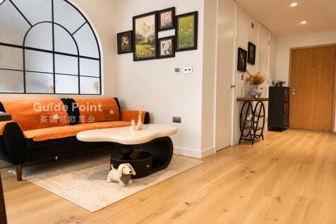 A modern 1st floor studio apartment in Greenwich Peninsula, offering stylish riverside living with floor-to-ceiling windows, underfloor heating, a marble-topped kitchen, and a high-spec bathroom.