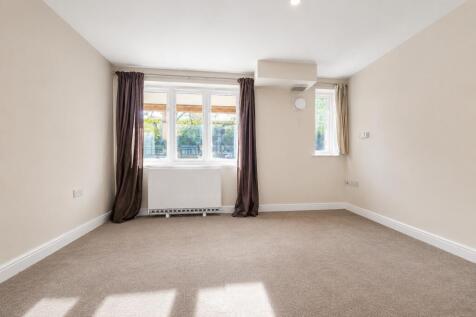 Spacious two bedroom, two bathroom ground-floor apartment set within the well maintained Centurion Court development, offering a separate reception room, generous accommodation, and excellent transpor