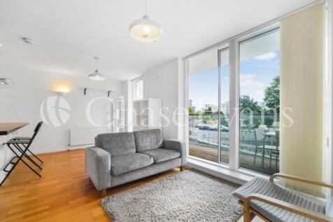Stunning two bedroom, two bathroom duplex apartment set within the modern Silver Wharf development, Canary Wharf E14. The first floor includes an airy living area with wood flooring and full-length wi