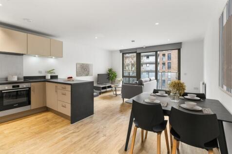 Explore this chic open-plan apartment designed with modern elegance and ample natural light.