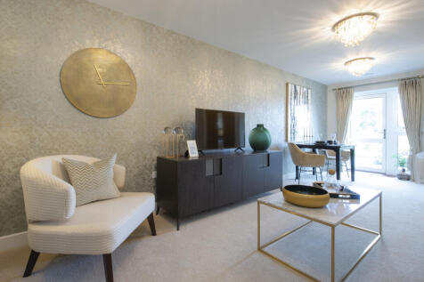 a living room with a white couch and a round table