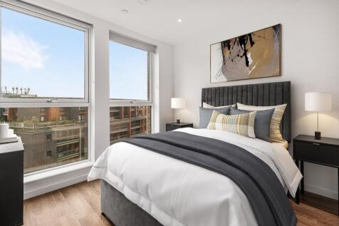 Explore this chic urban bedroom with its stylish decor and breathtaking city view.