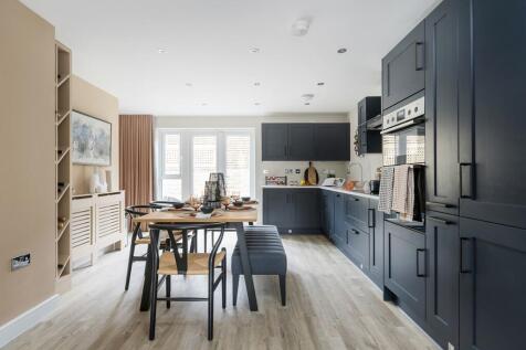 Double doors lead out from the kitchen to the garden