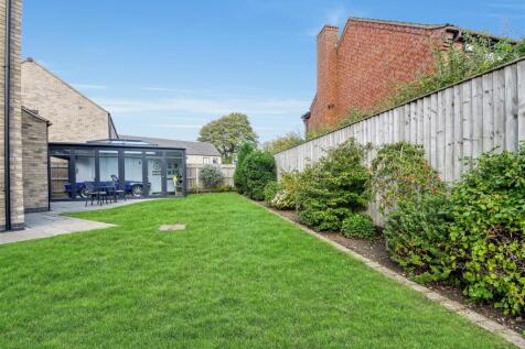 Side garden leading to addition garden room/worksh