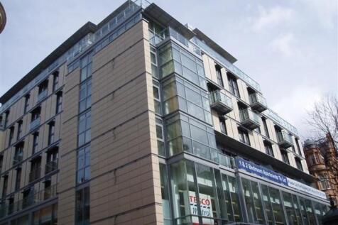 A spacious sixth floor apartment with balcony located in Temple House.