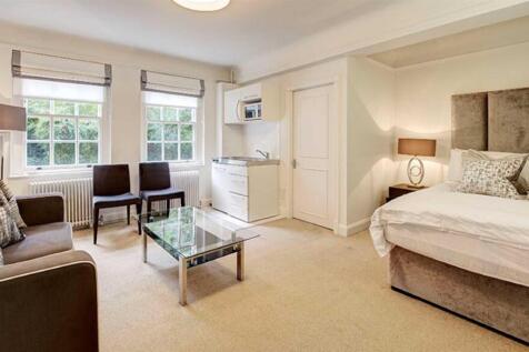 A spacious lower ground floor studio apartment to let within the prestigious building, Pelham Court. Located in the heart of Chelsea, this studio apartment looks straight out in the communal gardens.