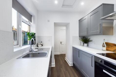 A stylish and well-equipped kitchenette with mo...