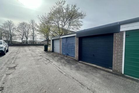 10-Garage-and-communal-parking-area-blue-sky.jpg