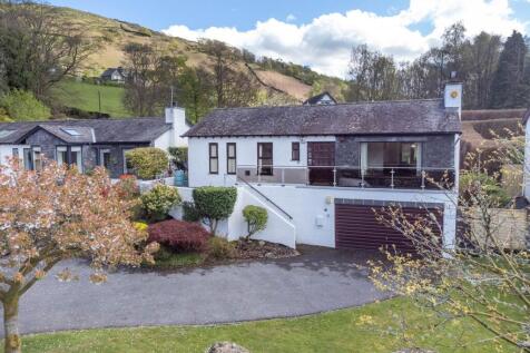 Front exterior with fells behind